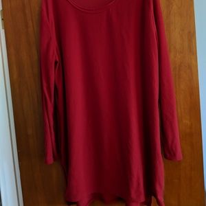 Red tunic with side zippers.
